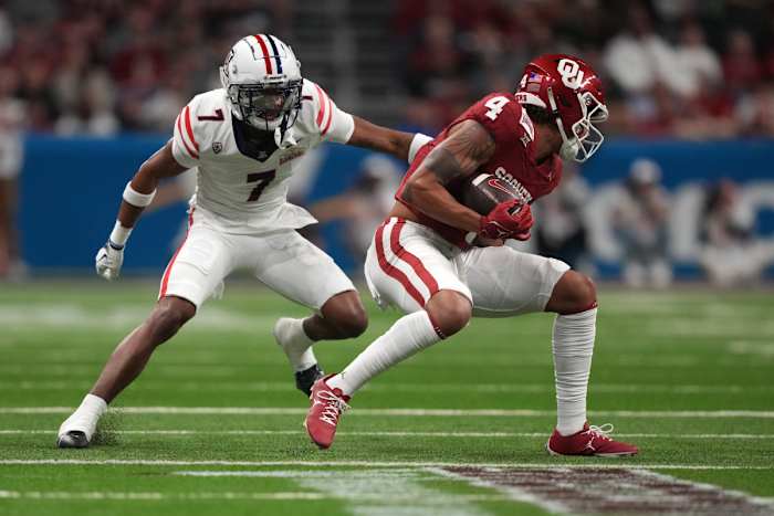 Dec 28, 2023; San Antonio, TX, USA; Oklahoma Sooners wide receiver Nic Anderson (4) catches the ball against Arizona Wildcats cornerback Ephesians Prysock (7) in the fist half of the Alamo Bowl at Alamodome. Mandatory Credit: Kirby Lee-USA TODAY Sports